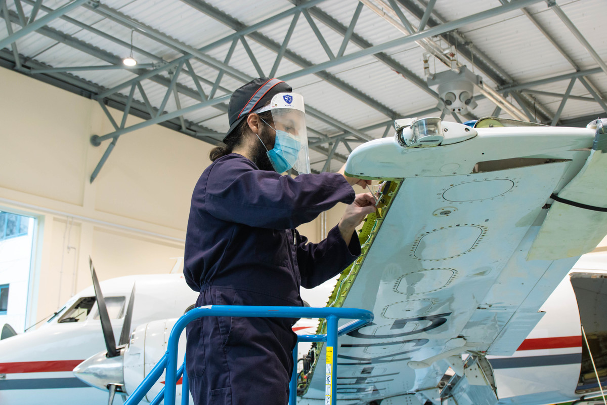 Student working on plane